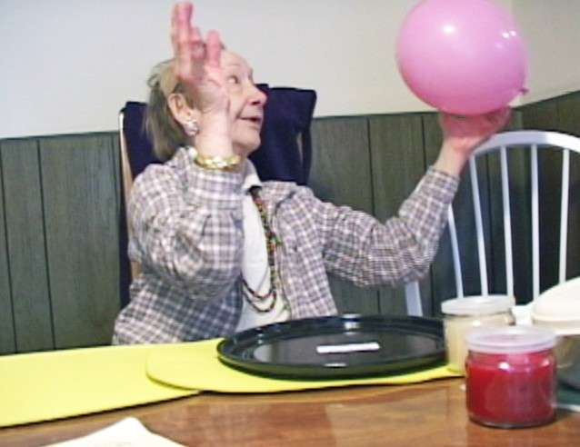 Balloon toss wellness activity for low-function adults